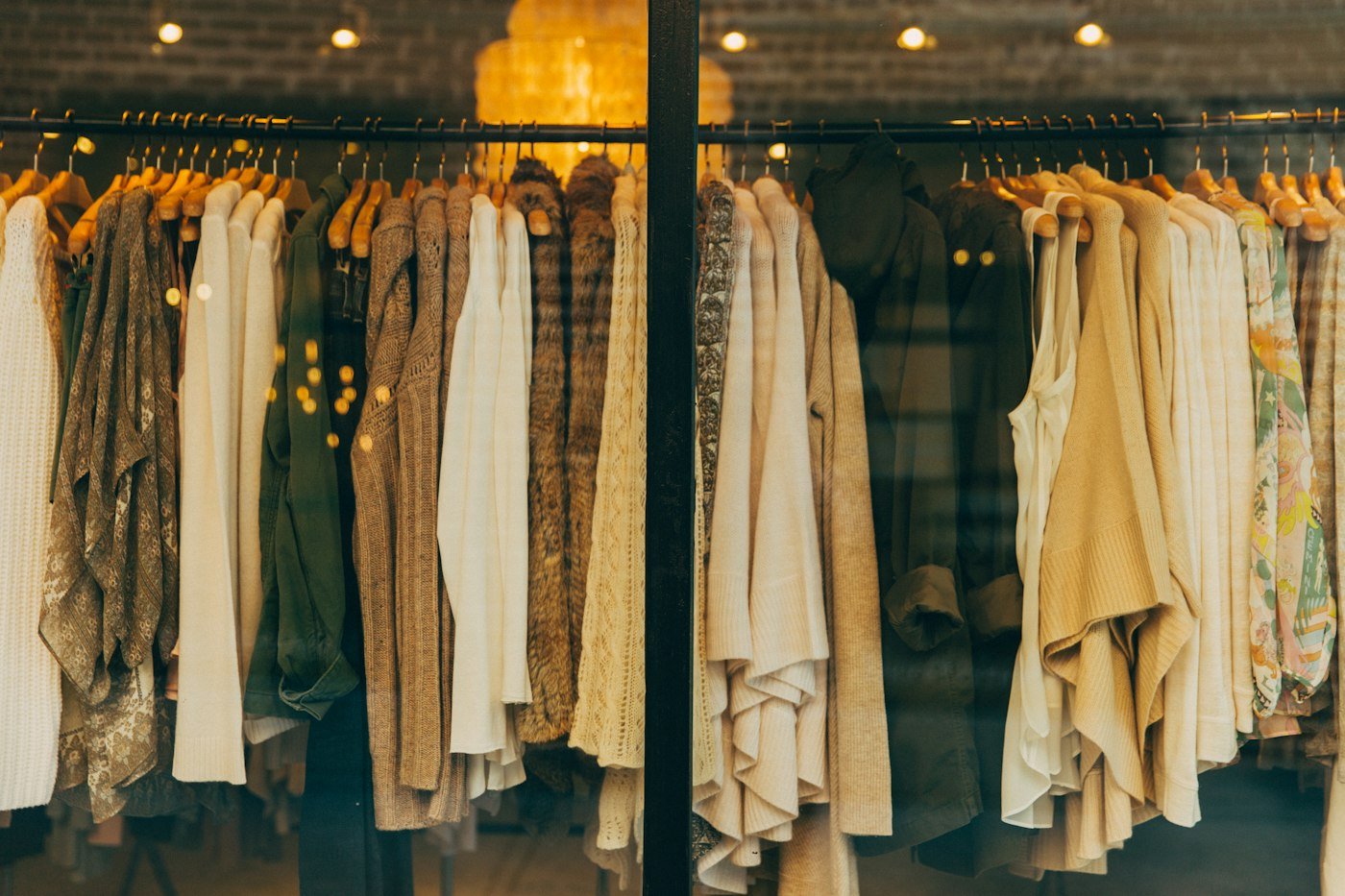 Neutral garments hanging in the Lakeside studio